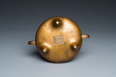 A Chinese bronze tripod censer, Xuande mark, 18th C.