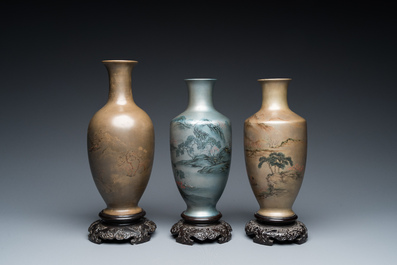 Three Chinese Fuzhou or Foochow lacquer 'landscape' vases on stands, 2nd half 20th C.