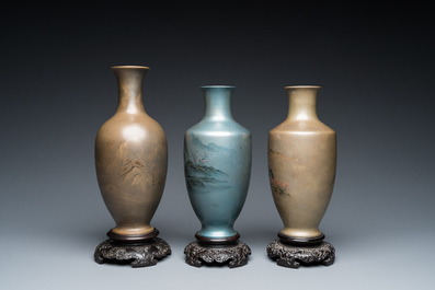 Three Chinese Fuzhou or Foochow lacquer 'landscape' vases on stands, 2nd half 20th C.