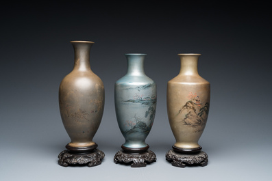 Three Chinese Fuzhou or Foochow lacquer 'landscape' vases on stands, 2nd half 20th C.