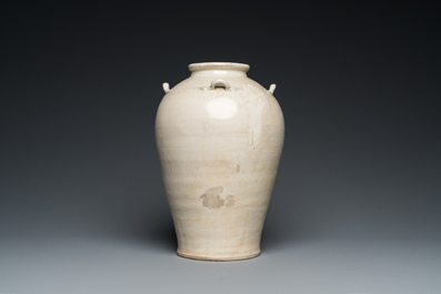 A Vietnamese white-glazed pottery vase with four ring handles, Ly, 11/13th C.