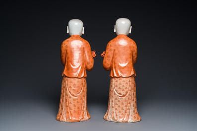 A pair of Chinese coral red 'Hehe Er Xian' sculptures, probably Jiaqing