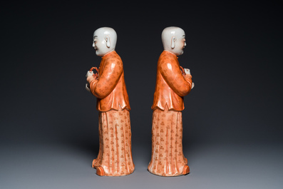 A pair of Chinese coral red 'Hehe Er Xian' sculptures, probably Jiaqing