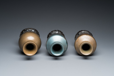 Three Chinese Fuzhou or Foochow lacquer 'landscape' vases on stands, 2nd half 20th C.