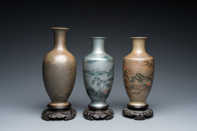 Three Chinese Fuzhou or Foochow lacquer 'landscape' vases on stands, 2nd half 20th C.