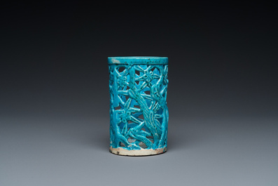 A Chinese reticulated monochrome turquoise brush pot on wooden stand, Qing