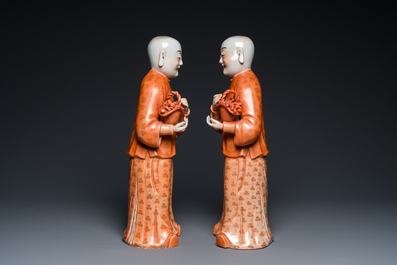A pair of Chinese coral red 'Hehe Er Xian' sculptures, probably Jiaqing
