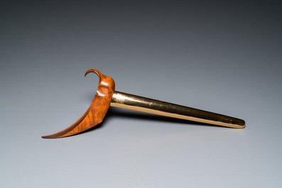 An Indonesian 'kris' or 'keris' dagger in polished Javanese wood with gilt copper and precious stones, 19th C.