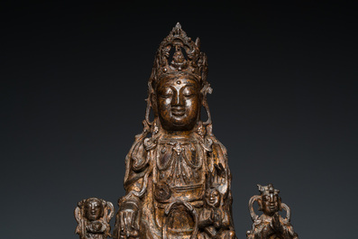 A large Chinese gilt bronze group of Guanyin with servants, Ming