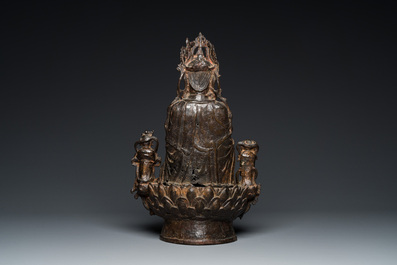 A large Chinese gilt bronze group of Guanyin with servants, Ming
