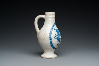 A Portuguese blue and white armorial ewer inscribed Jacob Schr&ouml;der, Lisbon, dated 1644