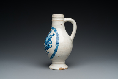 A Portuguese blue and white armorial ewer inscribed Jacob Schr&ouml;der, Lisbon, dated 1644