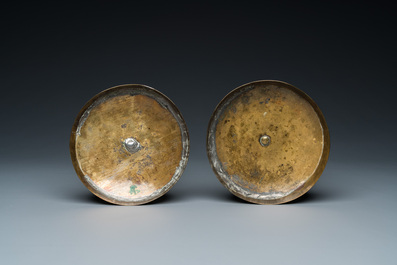 A pair of Dutch Delft blue and white tobacco jars with brass lids, 18th C.