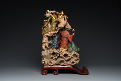 Een Chinese gepolychromeerde en gelakte houten 'onsterfelijken' groep, 19/20e eeuw
