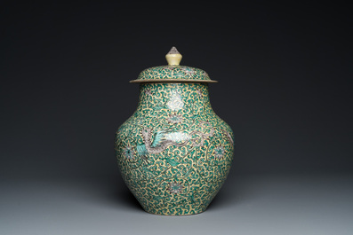 A Chinese yellow-ground verte biscuit 'dragons' vase and cover, 19th C.