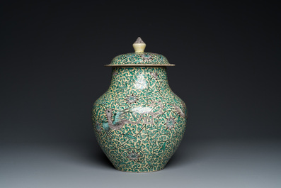A Chinese yellow-ground verte biscuit 'dragons' vase and cover, 19th C.