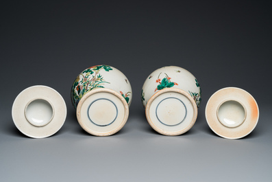 A pair of Chinese Nanking famille verte vases and covers, 19th C.