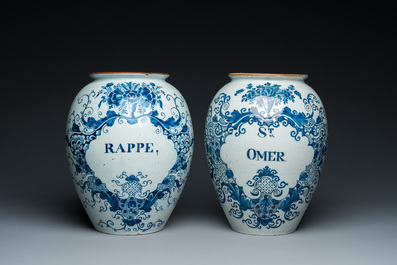 A pair of Dutch Delft blue and white tobacco jars with brass lids, 18th C.