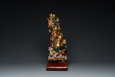A Chinese polychromed and lacquered wooden 'immortals' group, 19/20th C.