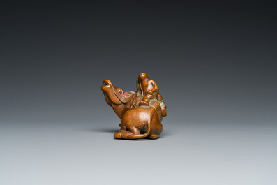 A Chinese bronze 'boy on buffalo' water dropper, Qing