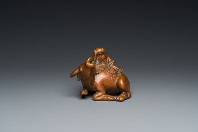 A Chinese bronze 'boy on buffalo' water dropper, Qing