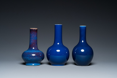 Three Chinese monochrome blue- and flamb&eacute;-glazed bottle vases, 19/20th C