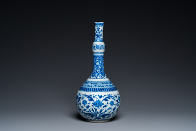 A Chinese blue and white bottle vase with floral design, Kangxi
