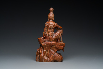 A Chinese wood sculpture of the seated Tara, 19th C.