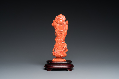 A Chinese red coral carving of Guanyin standing on a lotus throne, 19th C.