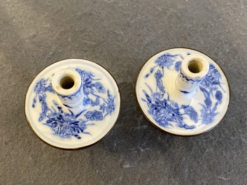 A pair of Chinese blue and white 'Bleu de Hue' candlesticks for the Vietnamese market, Kim Ngoc Cam Kee 金玉錦記 mark, 19th C.