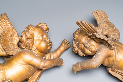 A pair of gilded wooden winged cherubs, probably Flanders, 1st half 18th C.