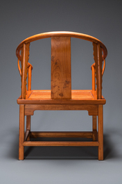 A pair of Chinese elmwood 'horseshoe' chairs, Republic