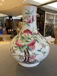 A Chinese famille rose 'nine peaches' bottle vase, 19th C.