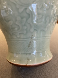 Een Chinese celadon-geglazuurde vaas met onderglazuur decor van pioenslingers, Qianlong