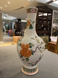 A Chinese famille rose vase with a bird among flowers, Yongzheng mark, 19th C.
