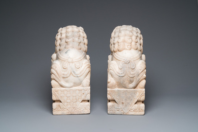 A pair of large Chinese white marble Buddhist lions, 19th C.