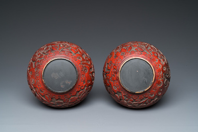 A pair of Chinese red cinnabar lacquer bottle vases, 19/20th C.