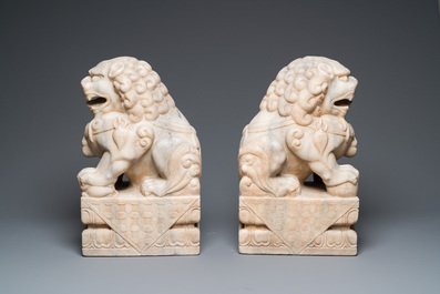 A pair of large Chinese white marble Buddhist lions, 19th C.