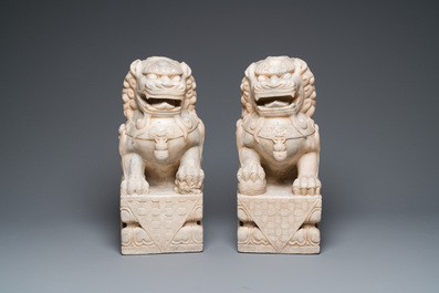 A pair of large Chinese white marble Buddhist lions, 19th C.