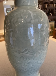 Een Chinese celadon-geglazuurde vaas met onderglazuur decor van pioenslingers, Qianlong