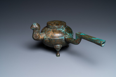 A Chinese gilt bronze tripod 'he' kettle with bird head-shaped spout, Han