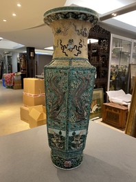 A Chinese hexagonal verte biscuit vase with applied dragon design, 19/20th C.