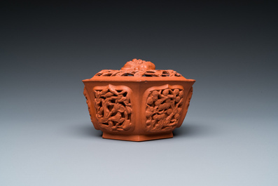 A Chinese Yixing stoneware reticulated hexagonal bowl and cover, Kangxi