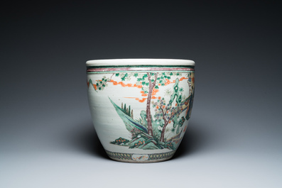 A Chinese famille verte fish bowl with female musicians in a garden, 19th C.