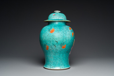 A Chinese turquoise-ground famille rose 'boys at a pomegranate tree' vase and cover, 19th C.