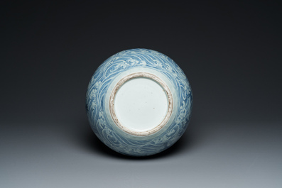 A Chinese blue and white 'dragons' bottle vase, 19th C.