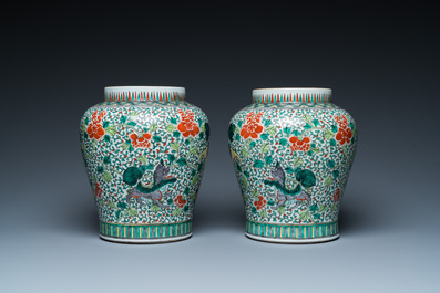 A pair of Chinese famille verte 'Buddhist lions' vases, 19th C.
