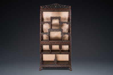 A Chinese reticulated hardwood display cabinet, 19th C.