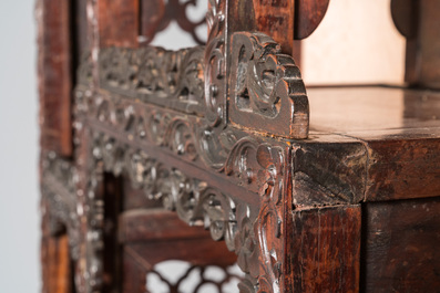 A Chinese reticulated hardwood display cabinet, 19th C.