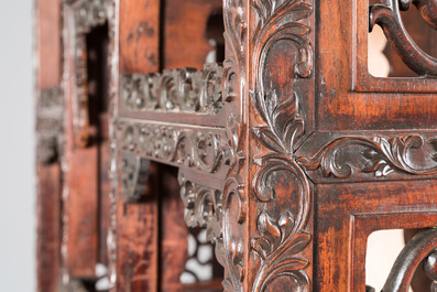 A Chinese reticulated hardwood display cabinet, 19th C.